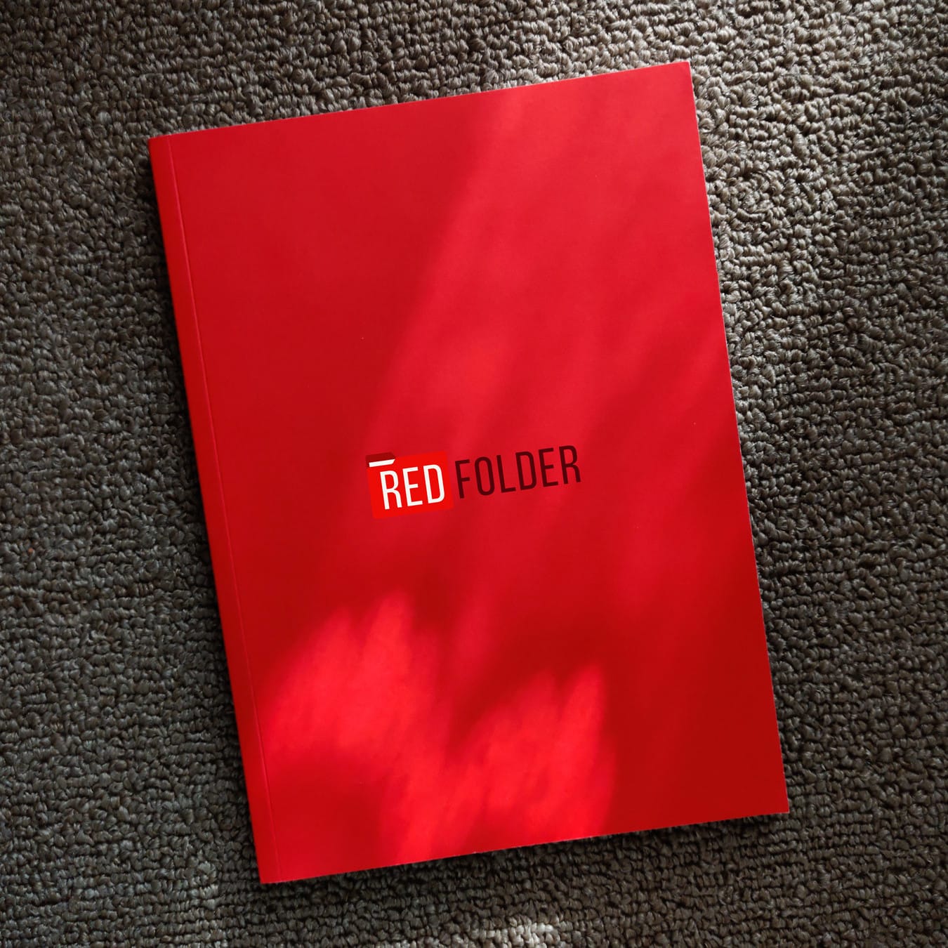 a red folder with the Redfolder logo on it