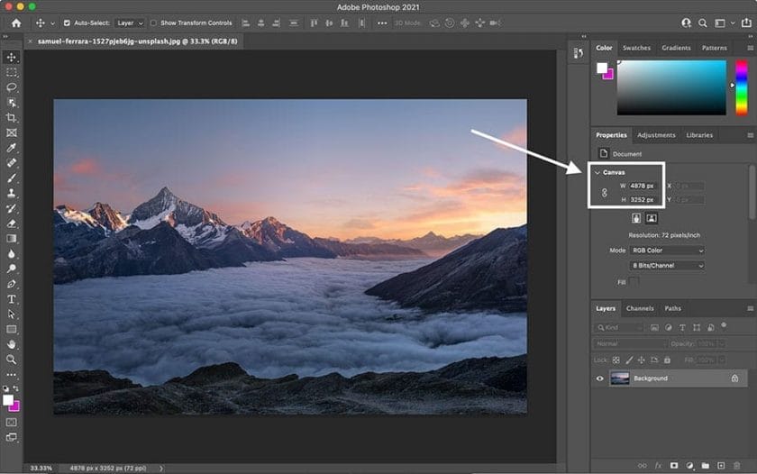 A photo in adobe photoshop with a mountain in the background, perfect for web design.