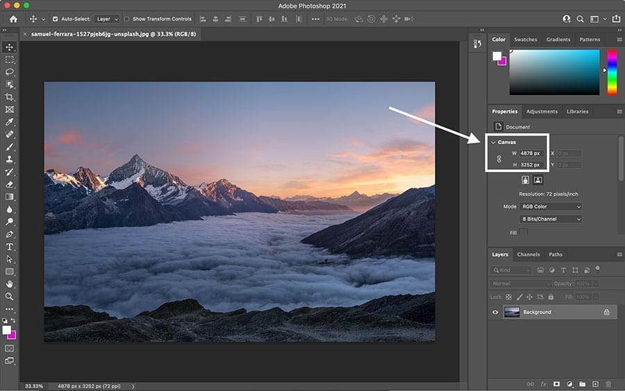 A photo in adobe photoshop with a mountain in the background, perfect for web design.