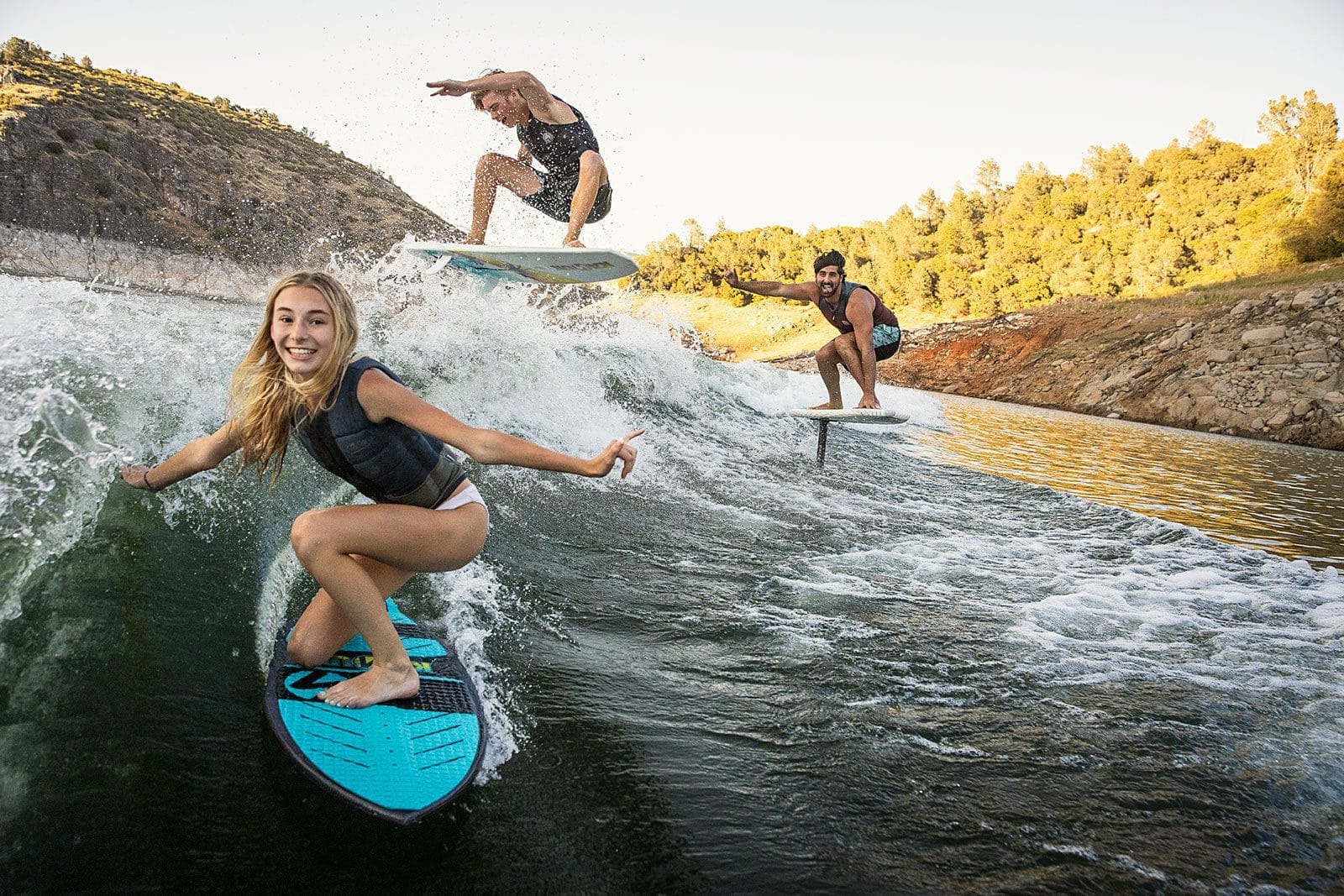 A group of people riding surfboards, captured in a vibrant web design.