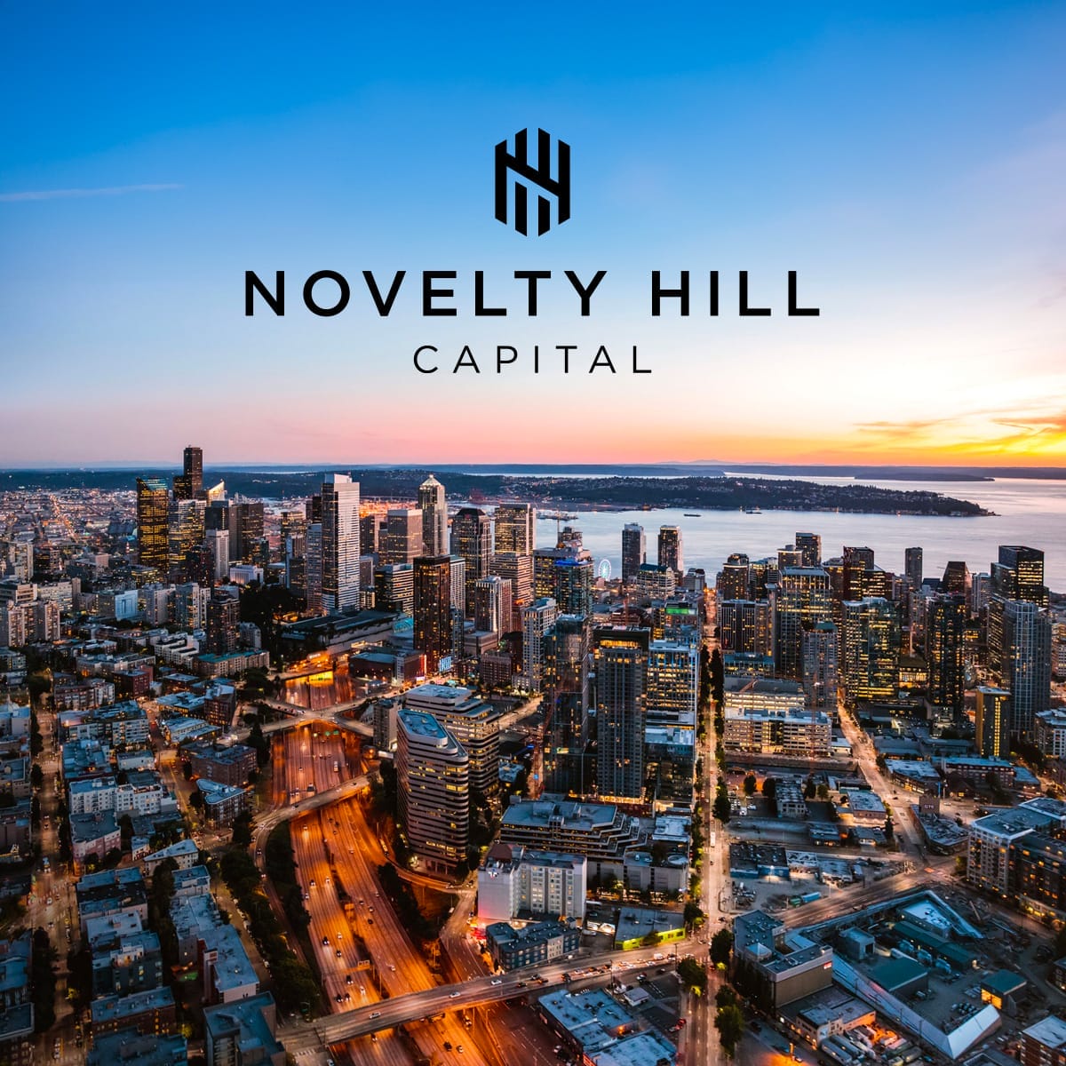 Seattle skyline with Novelty Hill Capital logo