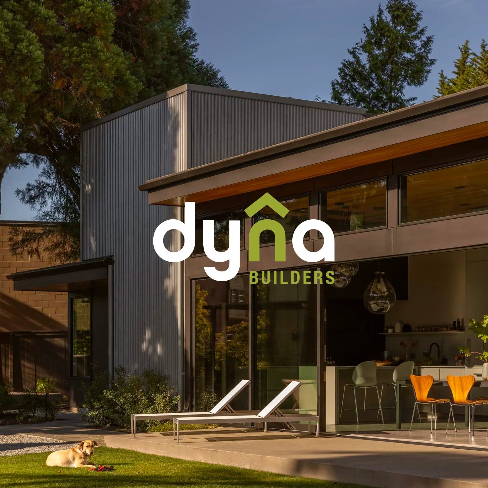 Dyna Builders logo in front of a house.